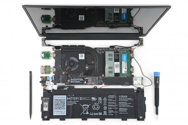 Motherboard, battery and screen of a Framework Laptop